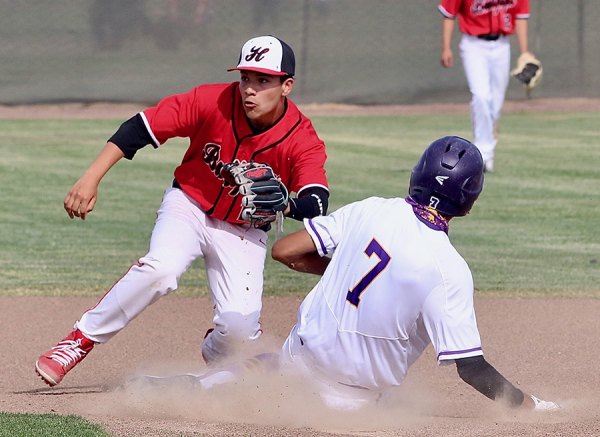 Lemoore dropped a West Yosemite League contest 3-0 to Hanford on April 30. In this photo Anfernee Murrieta steals second base ahead of a tag by Hanford's Dominik Perez.